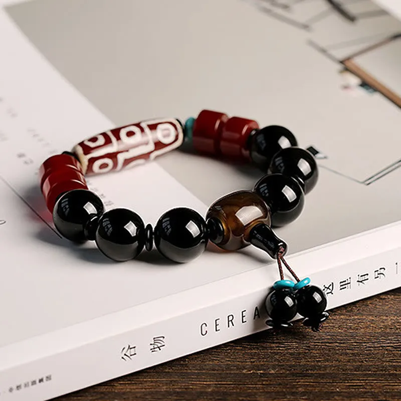 Tibetan Nine-Eye Dzi Bead Black Onyx Wealth Protection Bracelet in Luck Muse Shop - Image 3