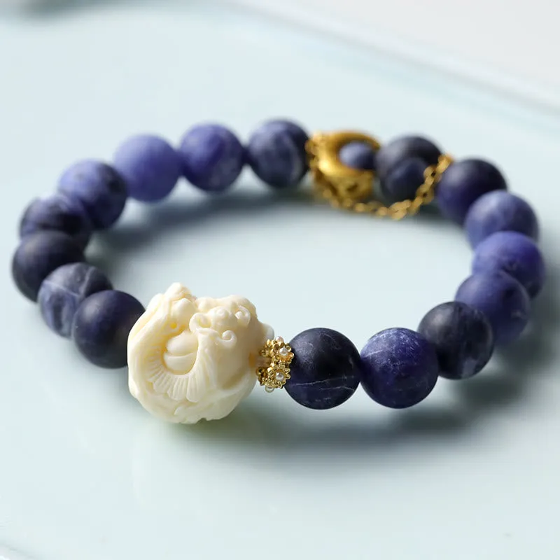 Luck Muse Sodalite Ivory Fruit Bracelet with Dancing Lion, Crescent Moon, and Harmony Design - Image 4