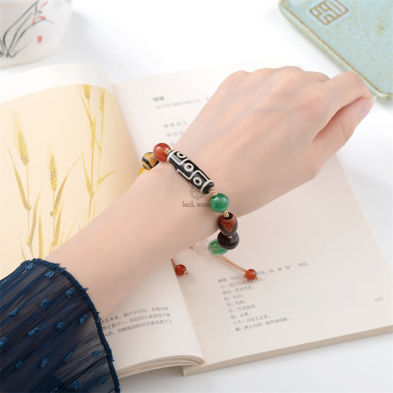 Tibetan Nine-Eye Dzi Bead Agate Bracelet for Wealth Protection at Luck Muse Shop - Image 12