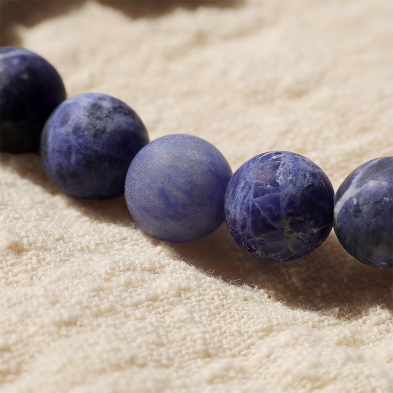 Luck Muse Sodalite Ivory Fruit Bracelet with Dancing Lion, Crescent Moon, and Harmony Design - Image 9