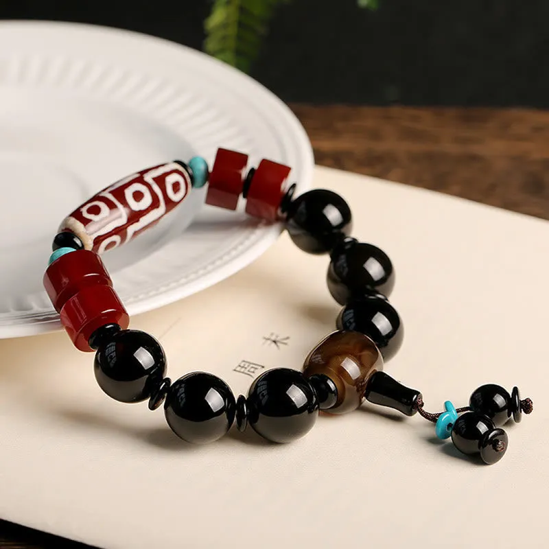 Tibetan Nine-Eye Dzi Bead Black Onyx Wealth Protection Bracelet in Luck Muse Shop - Image 2