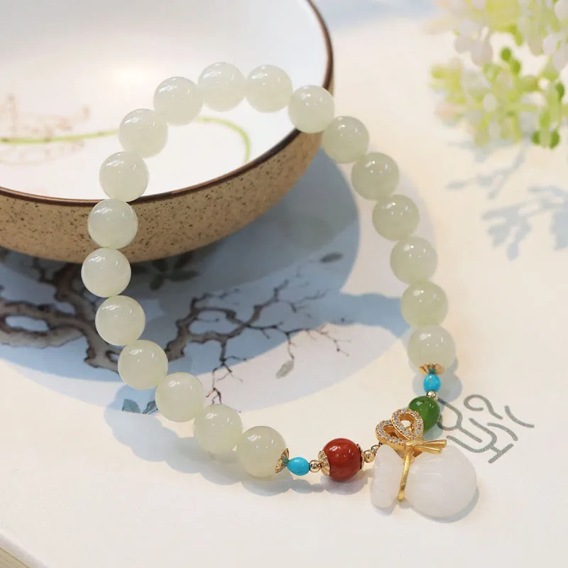Luck Muse Hetian White Jade Bracelet with 14K Gold Plated Money Bag Blessing - Image 2