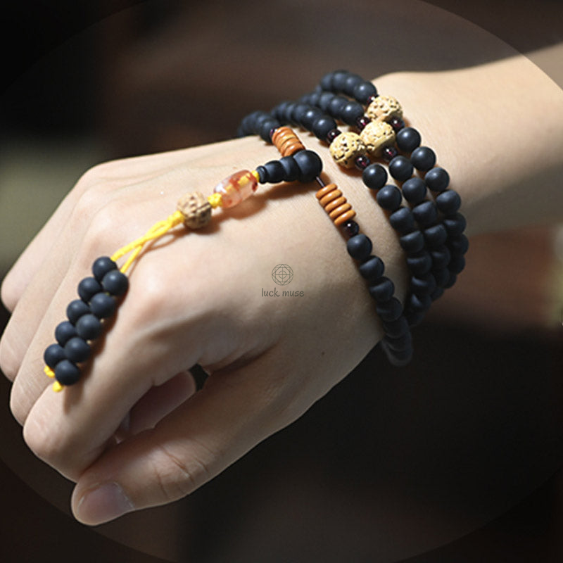 Tibetan Mala Bracelet with Cypress Bodhi Seeds and Red Agate Healing Properties - Image 4