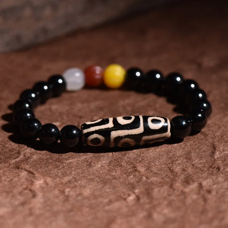 Natural Tibetan Nine-Eye Dzi Bead Bracelet for Wealth and Power - Image 2