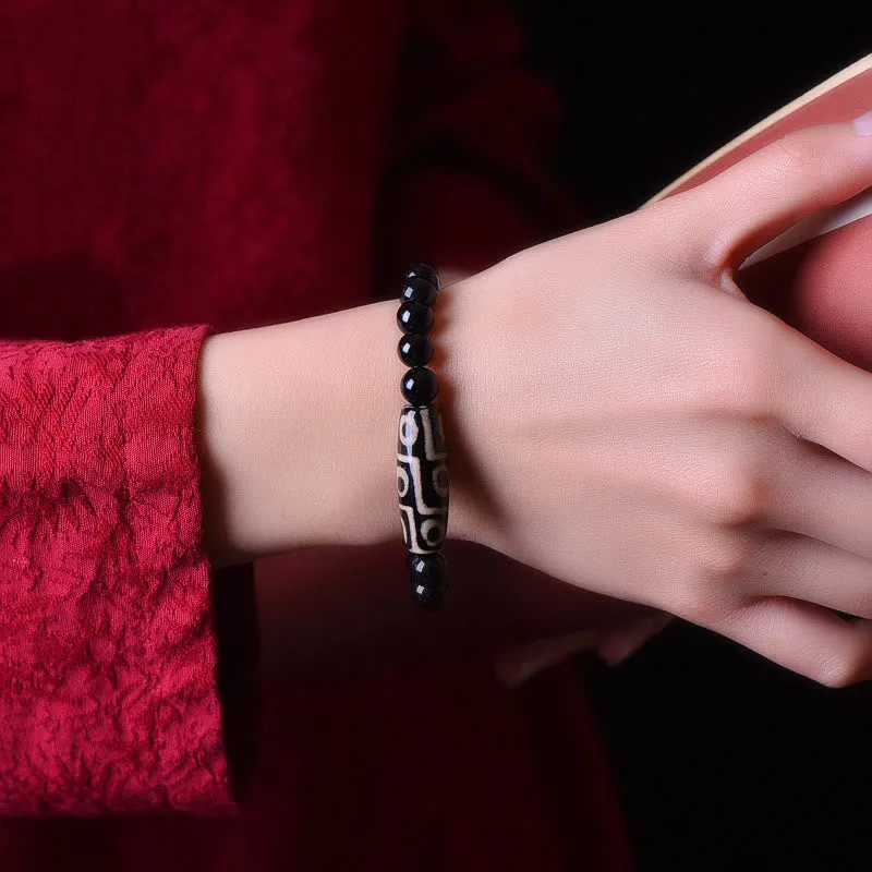 Natural Tibetan Nine-Eye Dzi Bead Bracelet for Wealth and Power - Image 5