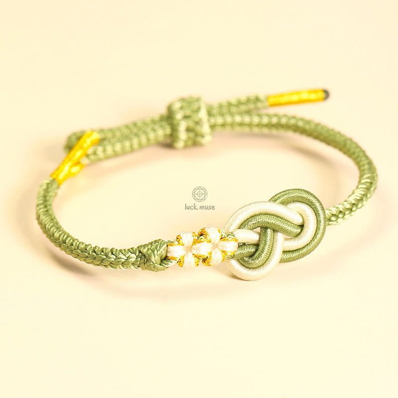 Handcrafted Eight-Thread Luck Muse Bracelet with Peace Knot, Peach Blossom Detail, and Luck Connection