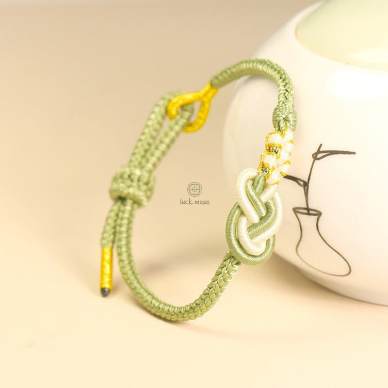 Handcrafted Eight-Thread Luck Muse Bracelet with Peace Knot, Peach Blossom Detail, and Luck Connection - Image 2