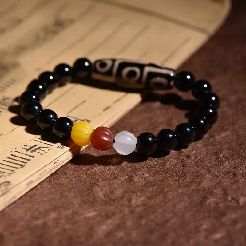 Natural Tibetan Nine-Eye Dzi Bead Bracelet for Wealth and Power - Image 4